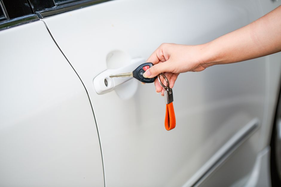 A hand inserting an ornate key into a lock, with dramatic lighting, representing how a small piece of knowledge can unlock significant financial opportunities.